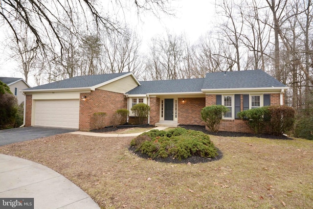 ranch-style home featuring a garage