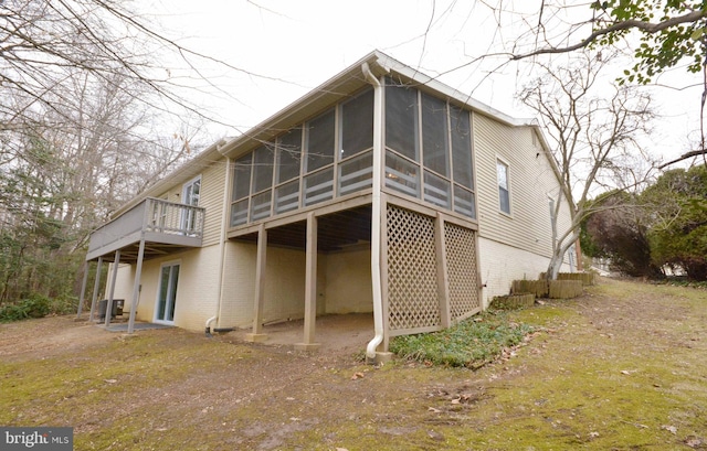 back of property featuring a sunroom