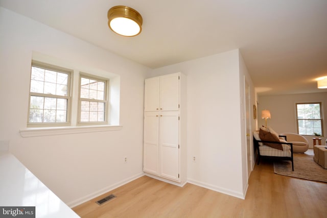 corridor featuring light hardwood / wood-style flooring