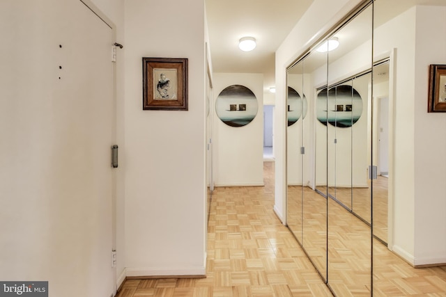 corridor with light parquet floors