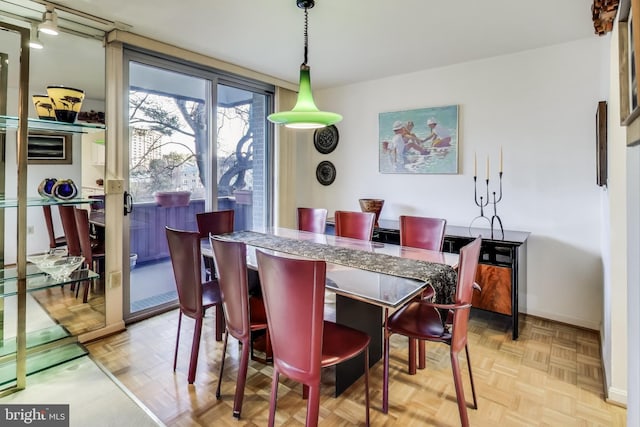 dining space with light parquet floors