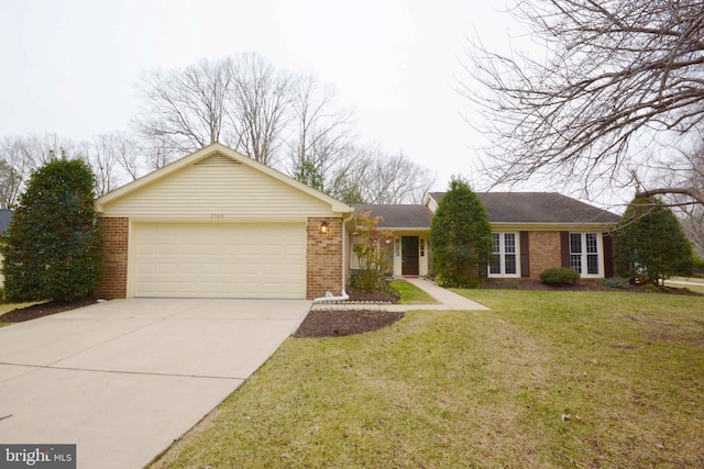 ranch-style home with a garage and a front lawn