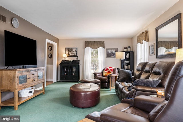 living room featuring visible vents, carpet floors, and a wealth of natural light