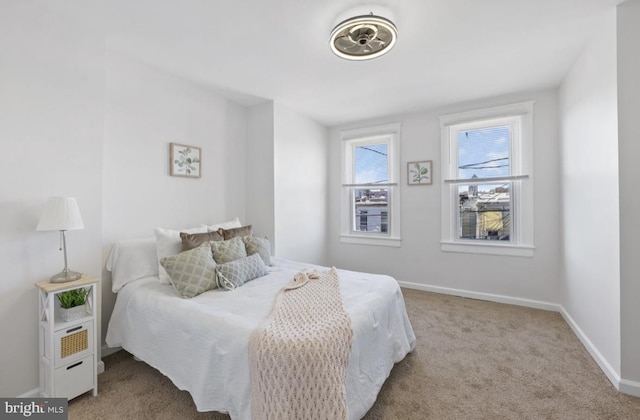 bedroom with carpet floors and baseboards