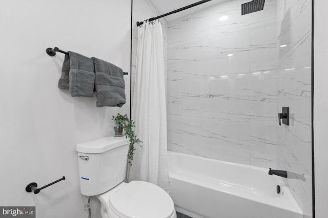 full bathroom featuring shower / bath combo with shower curtain and toilet