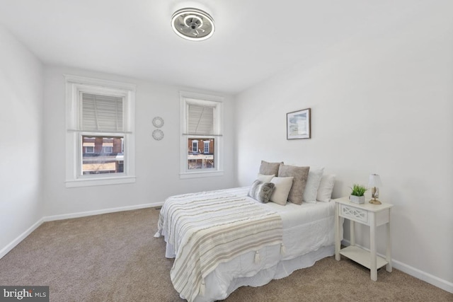 carpeted bedroom with baseboards