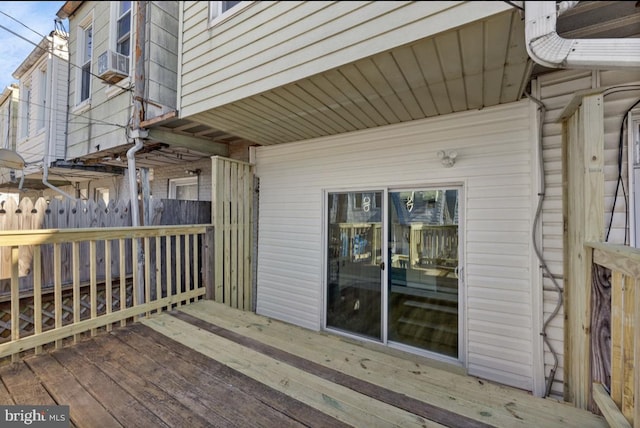 wooden deck with cooling unit and fence