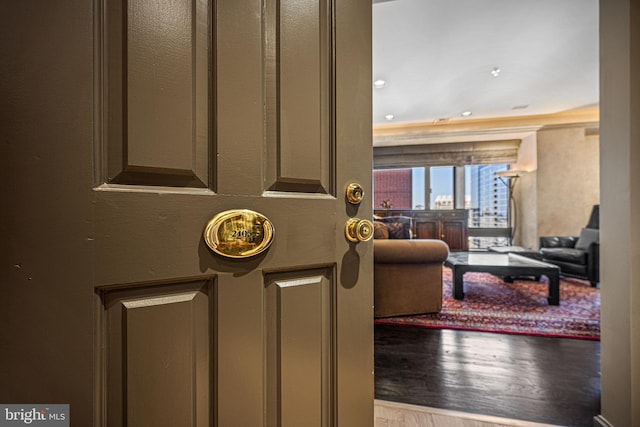 interior space with a view of city and wood finished floors