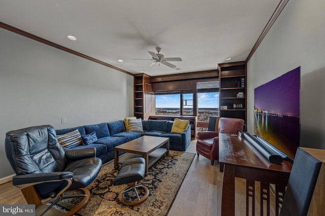 living room with ornamental molding, ceiling fan, light wood finished floors, and recessed lighting