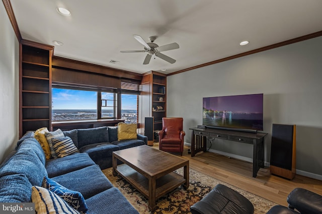 living area featuring baseboards, a ceiling fan, wood finished floors, crown molding, and recessed lighting