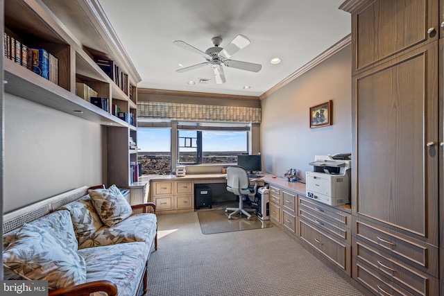 office featuring light carpet, a ceiling fan, ornamental molding, built in desk, and recessed lighting