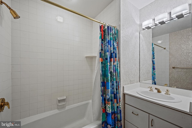 full bathroom featuring vanity and shower / bathtub combination with curtain