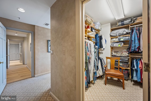 walk in closet featuring visible vents