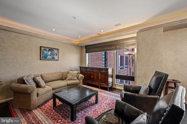 living room featuring a textured wall, wood finished floors, visible vents, and recessed lighting