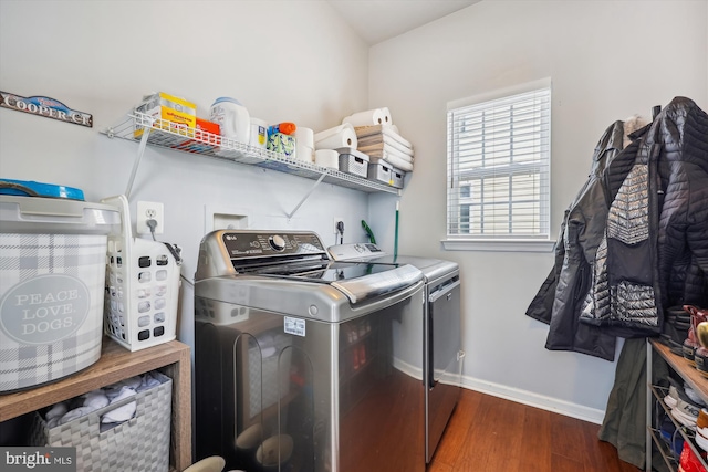 laundry room featuring washer and clothes dryer, laundry area, baseboards, and wood finished floors