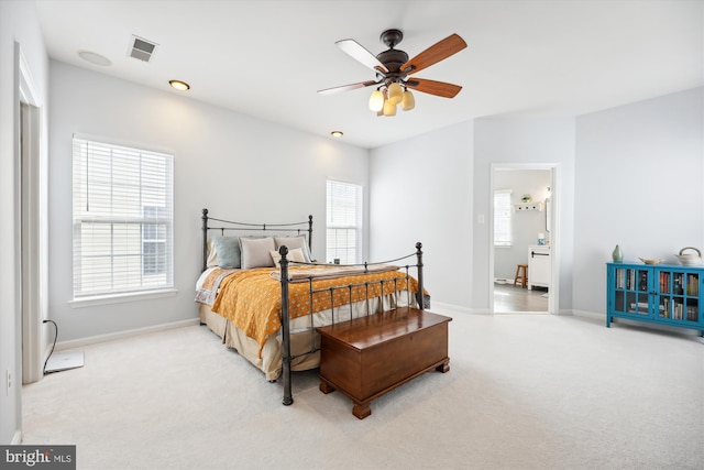 bedroom with visible vents, multiple windows, baseboards, and carpet floors