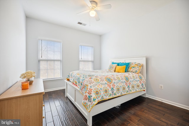 bedroom featuring visible vents, baseboards, ceiling fan, and dark wood-style flooring