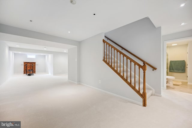 staircase with recessed lighting, carpet, and baseboards