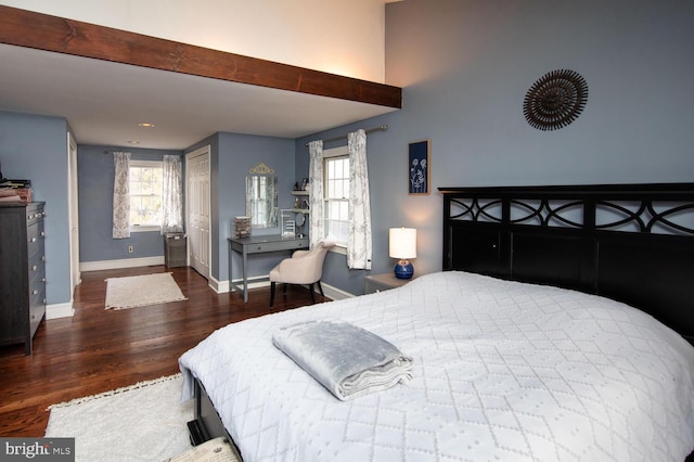 bedroom featuring dark hardwood / wood-style flooring