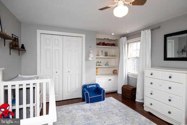 bedroom with ceiling fan, dark hardwood / wood-style floors, and a closet