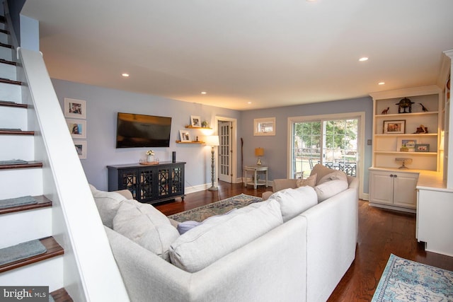 living room with dark hardwood / wood-style floors