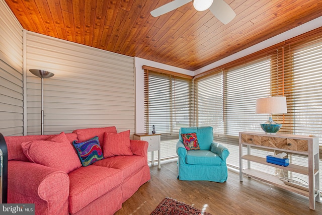 living room with ceiling fan, hardwood / wood-style floors, and wooden ceiling