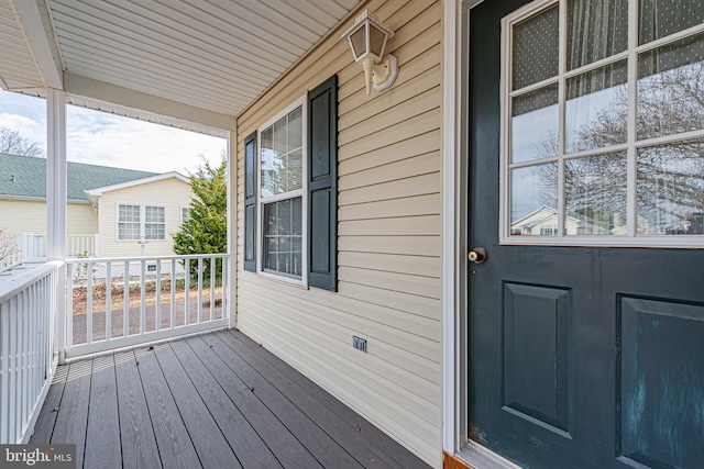 doorway to property featuring covered porch