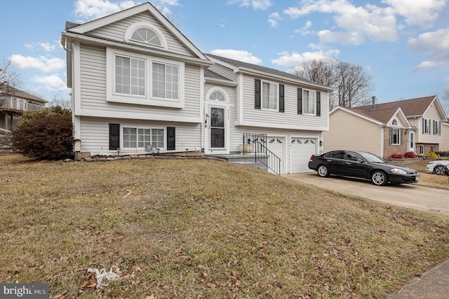 raised ranch with a garage and a front lawn