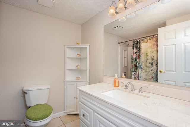 bathroom with tile patterned flooring, vanity, toilet, a textured ceiling, and a shower with curtain