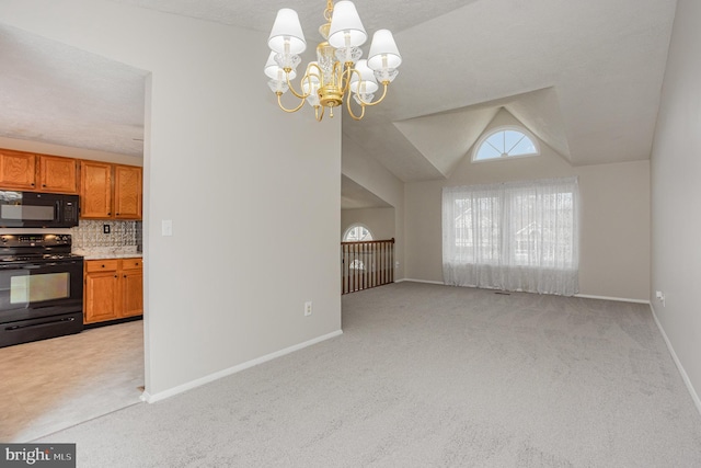 kitchen with decorative light fixtures, lofted ceiling, backsplash, black appliances, and light carpet