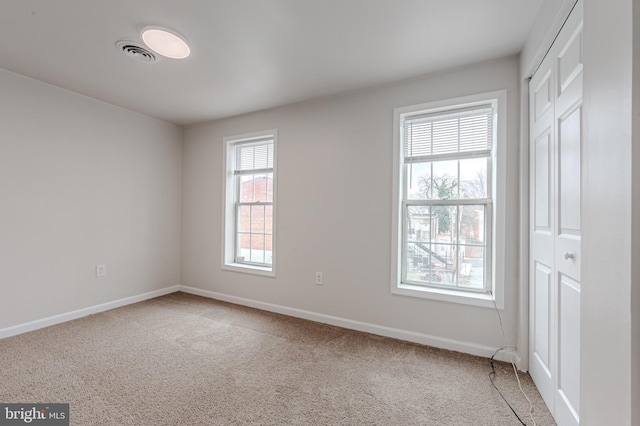 unfurnished room featuring carpet floors