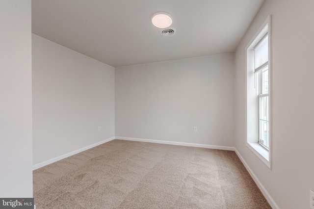 empty room featuring carpet floors