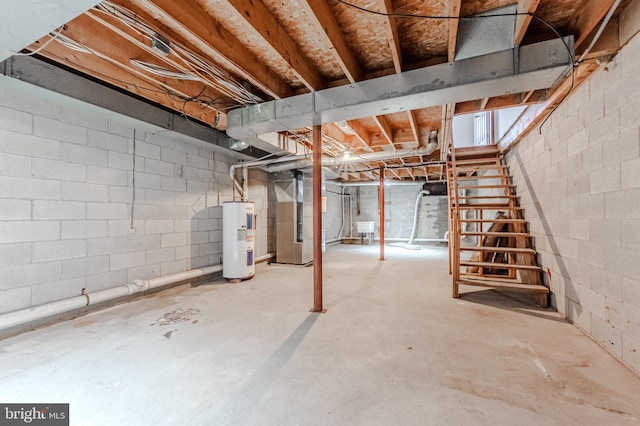 basement featuring electric water heater and heating unit