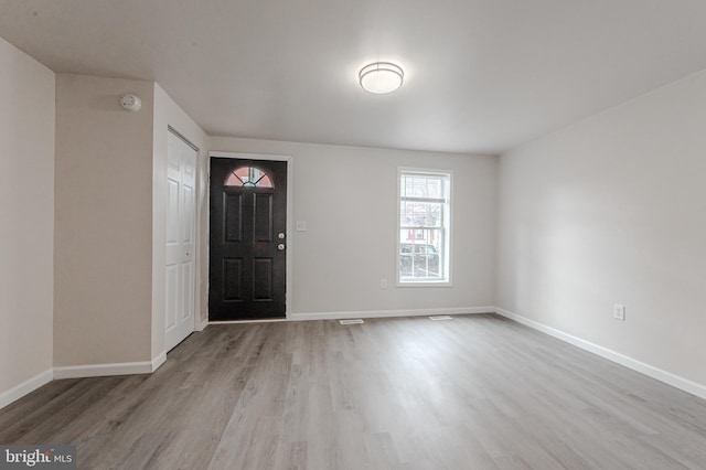 foyer entrance featuring light wood-type flooring