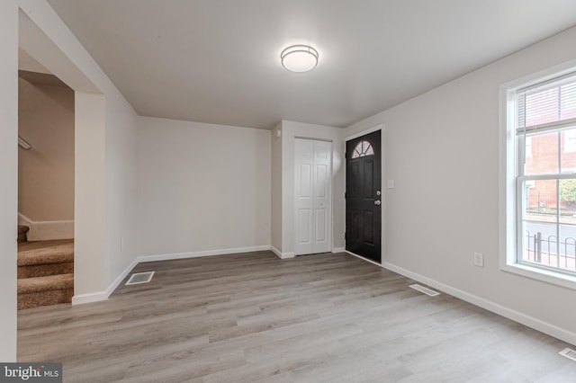 spare room with light wood-type flooring