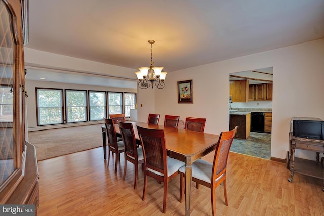 338 Blue Heron Rd, Dover, DE 19904 - dining room with an inviting chandelier and light hardwood / wood-style flooring