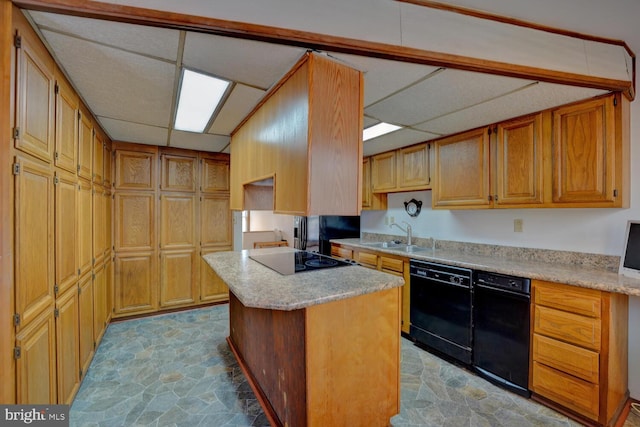 338 Blue Heron Rd, Dover, DE 19904 - kitchen featuring a kitchen island, sink, a paneled ceiling, and black appliances