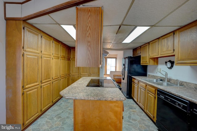 338 Blue Heron Rd, Dover, DE 19904 - kitchen with a paneled ceiling, a center island, sink, and black appliances