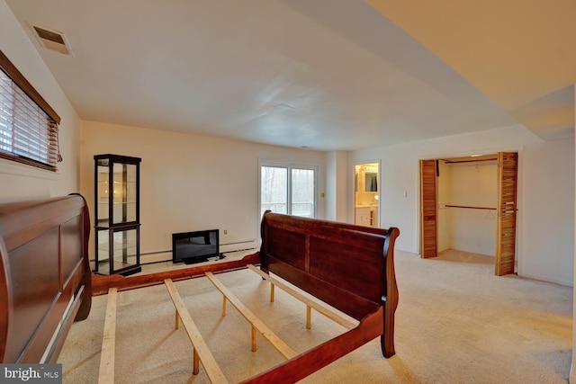 338 Blue Heron Rd, Dover, DE 19904 - carpeted bedroom with a baseboard heating unit