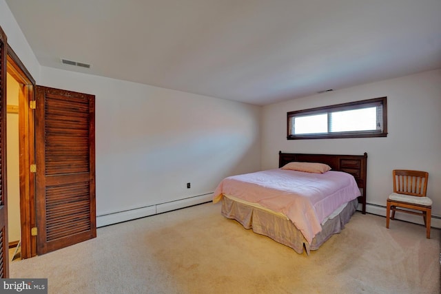 338 Blue Heron Rd, Dover, DE 19904 - bedroom with light colored carpet and baseboard heating