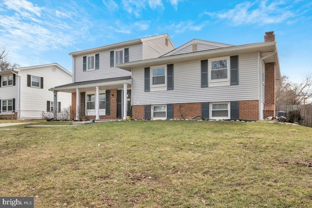 split level home featuring a front yard