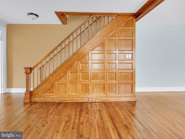 stairway featuring wood-type flooring