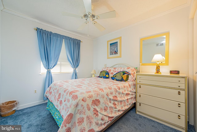 bedroom featuring dark carpet, crown molding, and ceiling fan