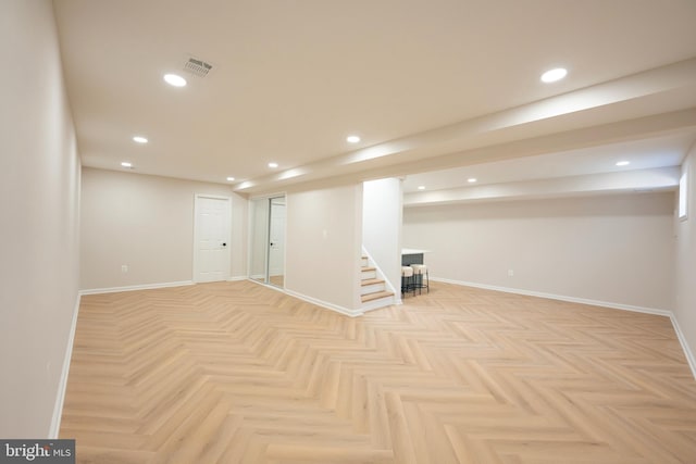 finished below grade area featuring recessed lighting, visible vents, and baseboards