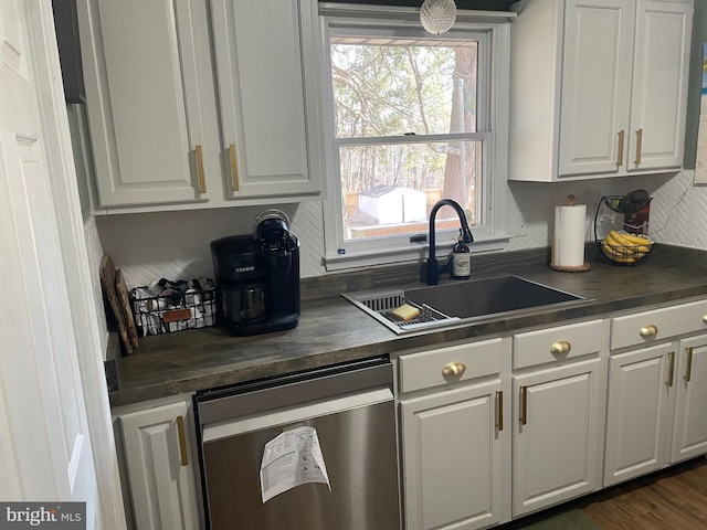 kitchen with white cabinetry, sink, and dark wood-type flooring