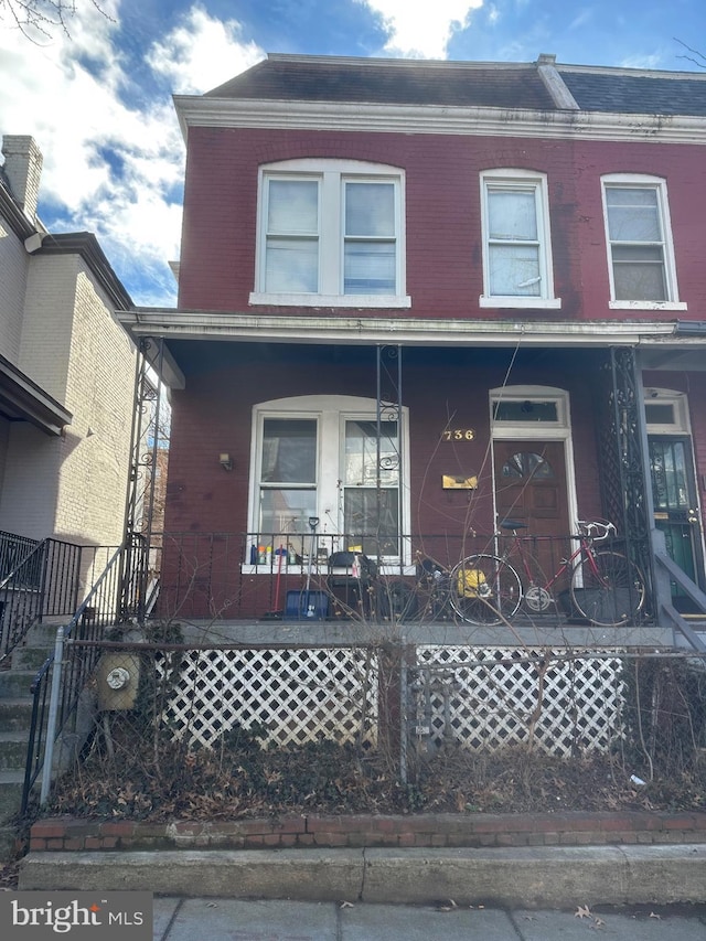 view of property with a porch