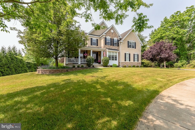 view of front of property with a front lawn and a porch