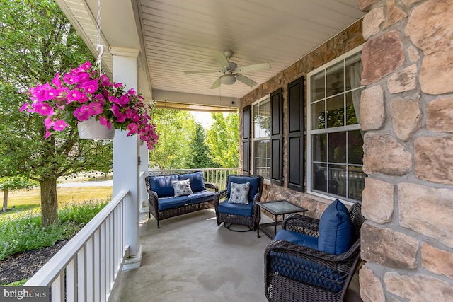 view of patio featuring ceiling fan and a porch