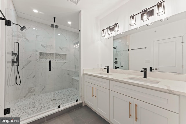 bathroom with walk in shower, tile patterned floors, and vanity