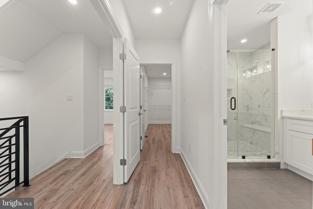 hall with light hardwood / wood-style floors